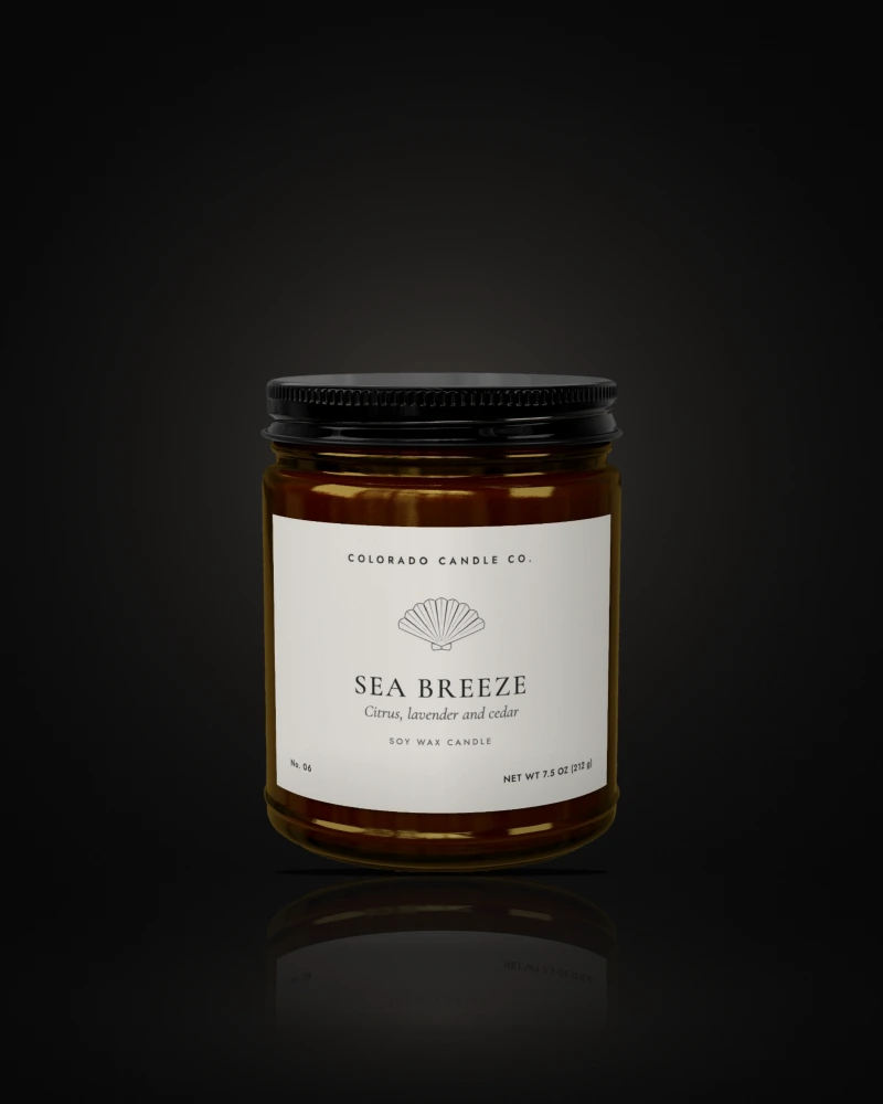 Sea Breeze soy candle in a 9 oz amber glass jar with a black lid