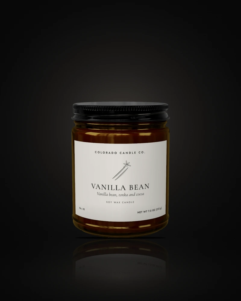 Vanilla Bean soy candle in a 9 oz amber glass jar with a black lid