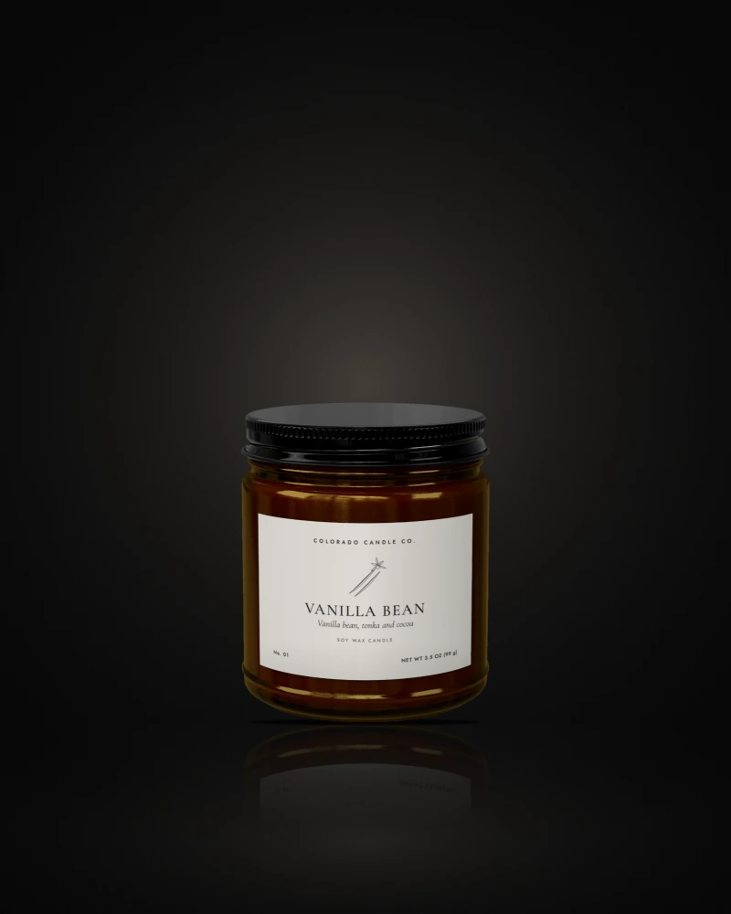 Vanilla Bean soy candle in a 4 oz amber amber glass jar with a black lid